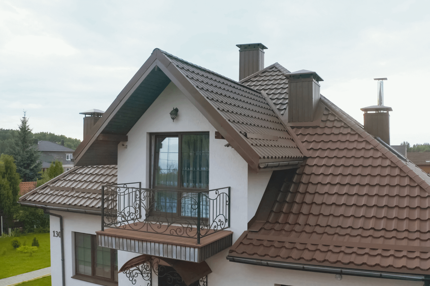 Columbia Mo Roofing Company Installed Custom Metal Roof on Beautiful House with curb appeal