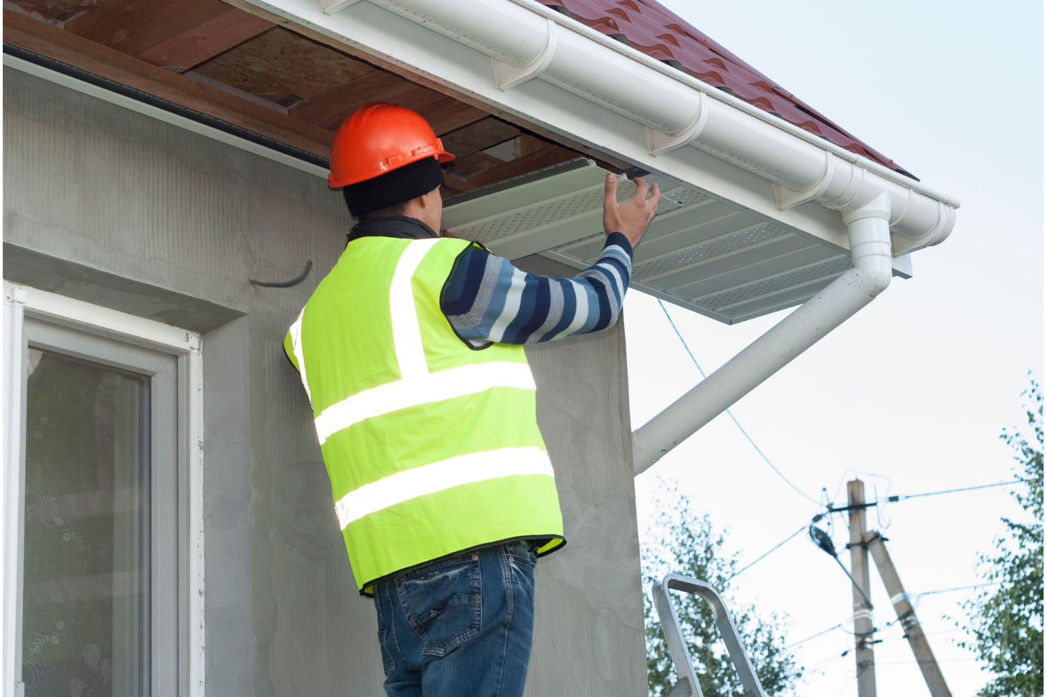 Installation of soffit and fascia on a house exterior