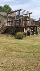 alt="Deck before renovation at Holts Summit site"