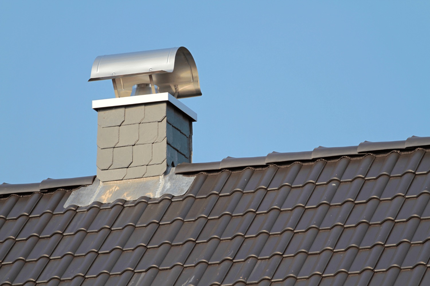 Illustration of roof crickets installed behind a chimney 