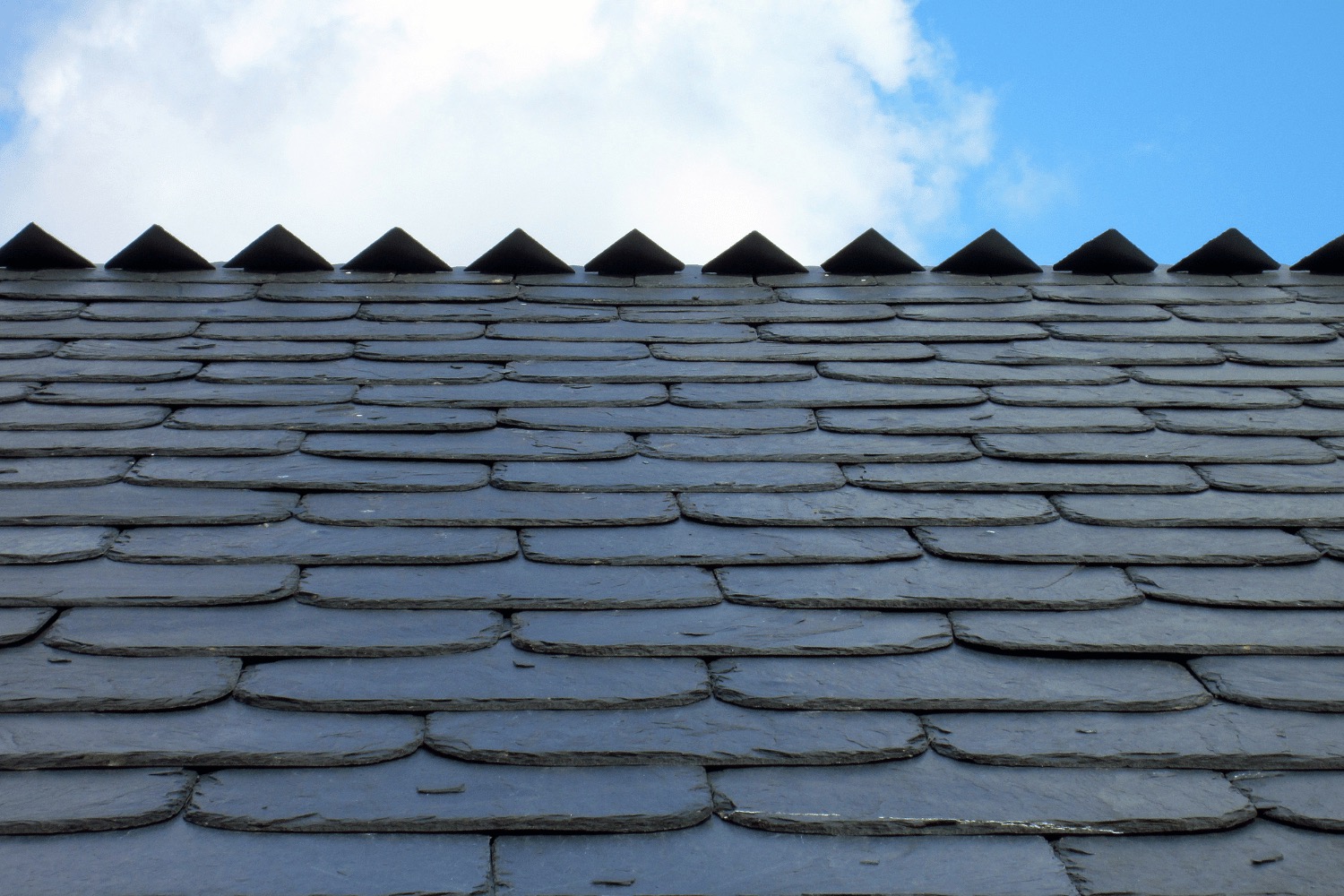 An infographic illustrating the cost considerations of slate roofing. 