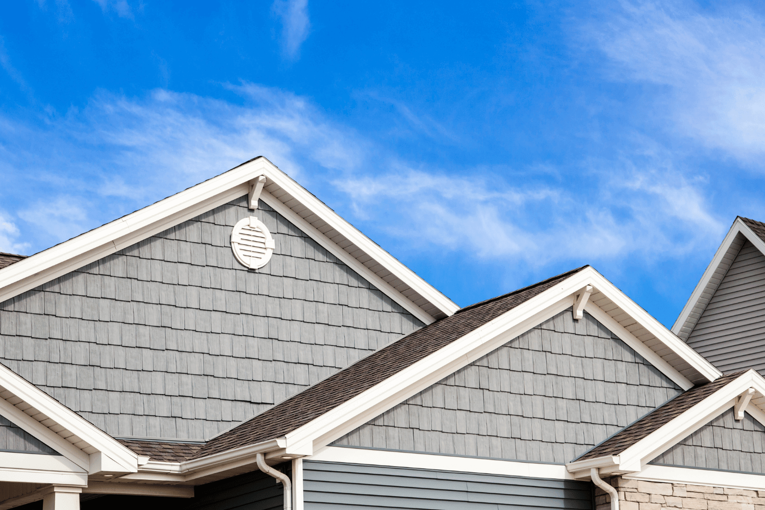 A creative depiction of HardieShingle siding on a charming cottage.