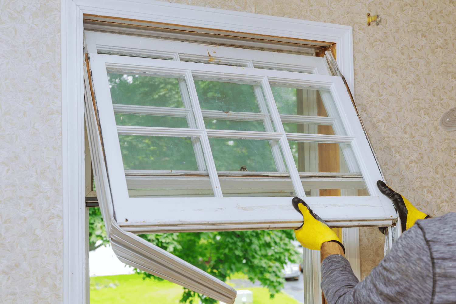 An illustration of a new double hung window being installed in a window opening, highlighting the installation process.