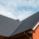 An illustration depicting a homeowner selecting roofing materials, considering durability and aesthetics.