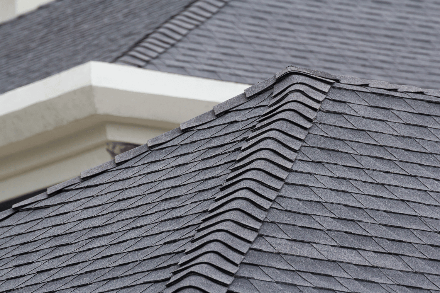 An illustration displaying different types of asphalt shingles, including 3-tab and architectural shingles. 