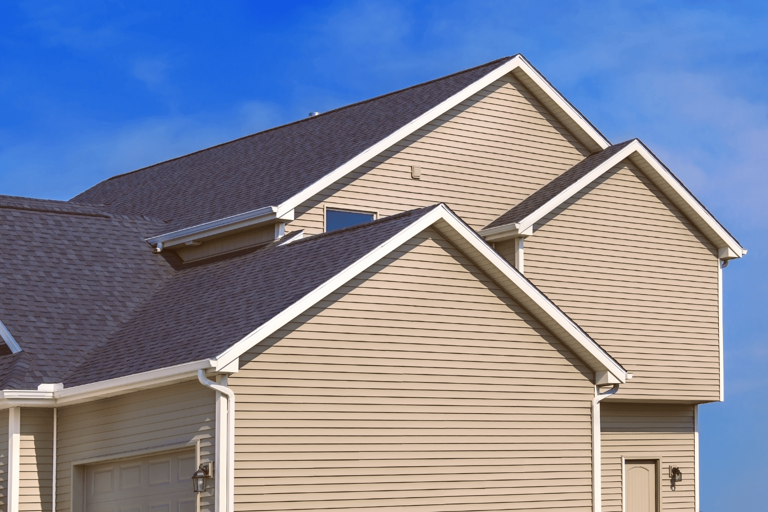 A beautiful house showcasing enhanced curb appeal with new siding. 