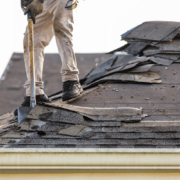 An image depicting the process of shingle removal from a roof.