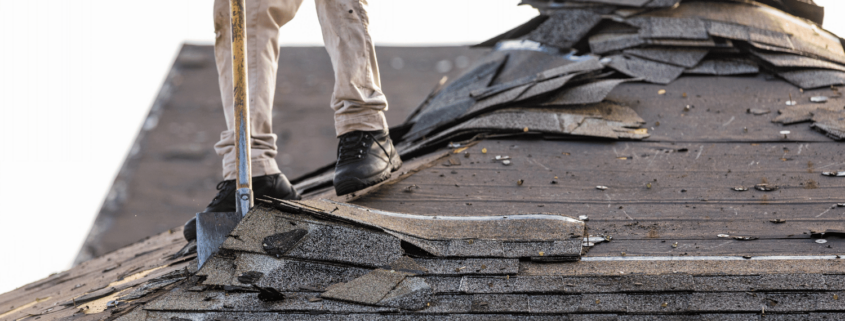 An image depicting the process of shingle removal from a roof.