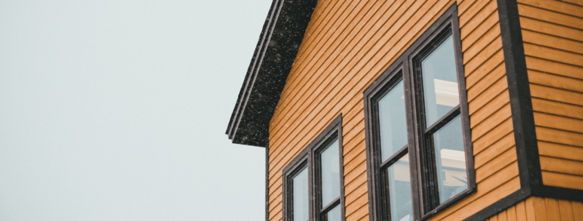 An example of vinyl siding on a modern home, showcasing its smooth finish and vibrant color.