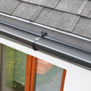 An overview of gutter splash guards installed on a house.