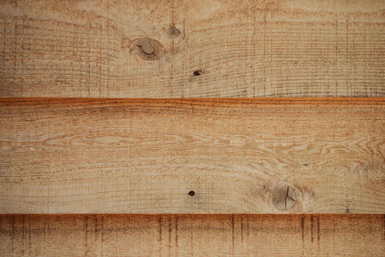 Signs of deterioration on cedar siding that indicate it's time for replacement. 