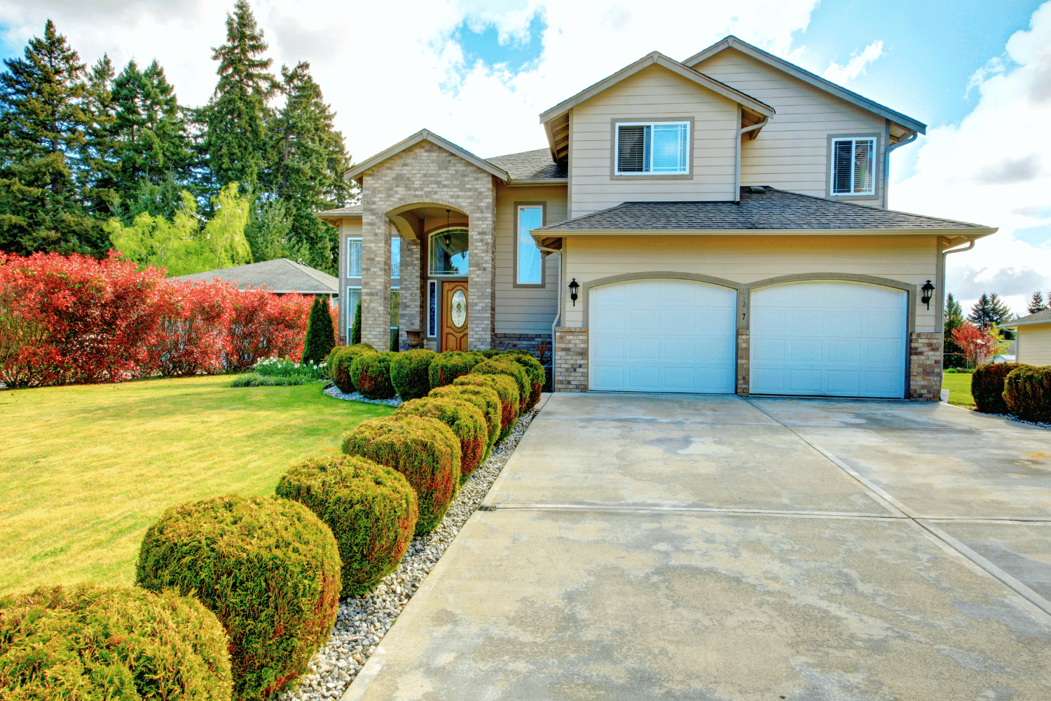 A beautiful home featuring stone veneer that enhances its value and curb appeal. 