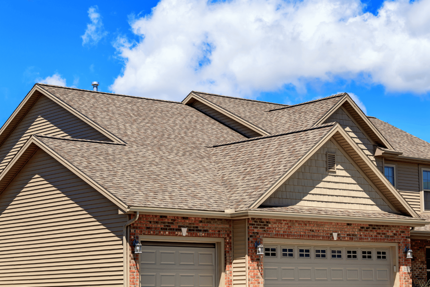 A well-maintained asphalt shingle roof showcasing the benefits of using shingle sealant. 