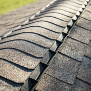 Before and after images of a roof treated with shingle sealant.