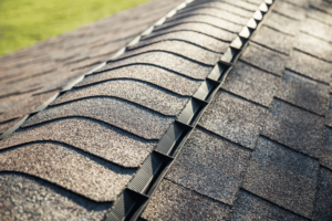 Before and after images of a roof treated with shingle sealant.