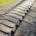 Before and after images of a roof treated with shingle sealant.