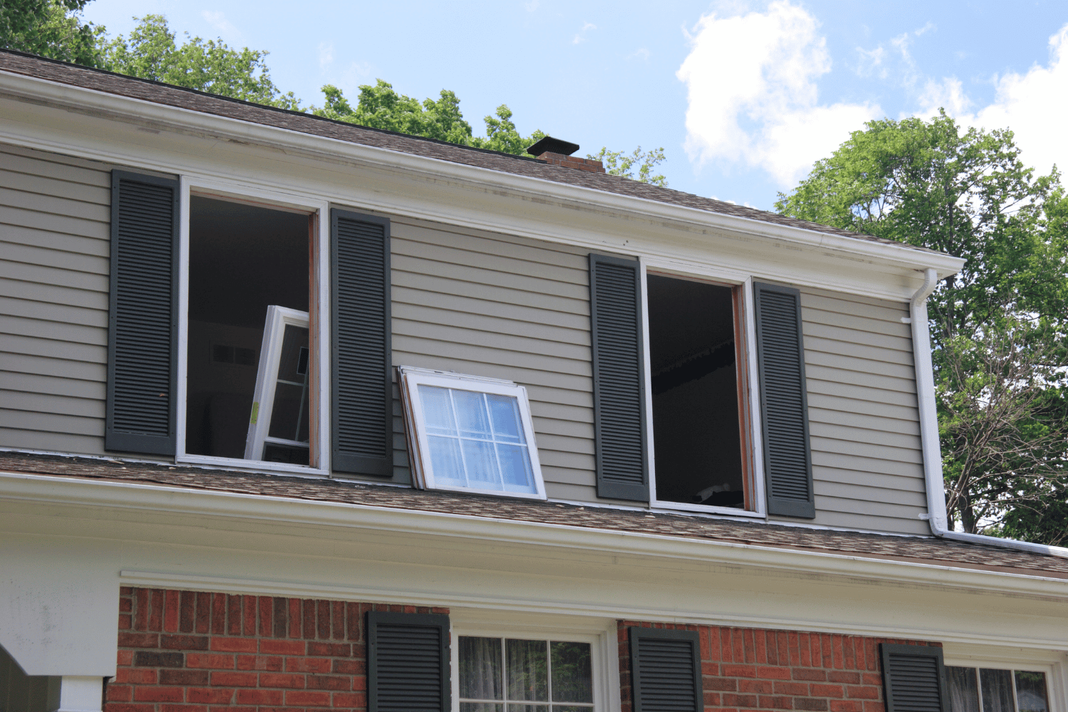 A new window being installed into a window opening. 