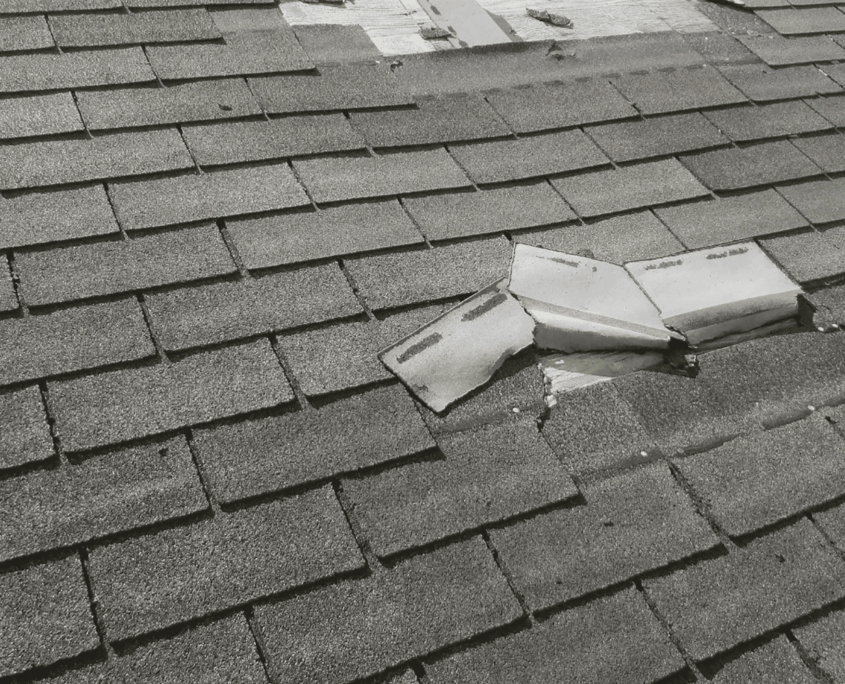 Image of damaged asphalt shingles