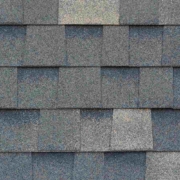 Close-up texture of dark gray asphalt roofing shingles