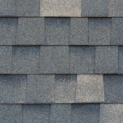 Close-up texture of dark gray asphalt roofing shingles