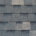 Close-up texture of dark gray asphalt roofing shingles