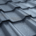 A close-up view of interlocking metal roofing panels showcases their superior construction quality, highlighting the durability and low maintenance benefits of metal roofs compared to traditional asphalt shingles. This image emphasizes the importance of choosing the best roofing materials for mid-Missouri homeowners facing extreme weather conditions.
