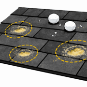 The image shows close-up details of hail damage on gray asphalt roof shingles, highlighting dimples and granule loss that can affect the roof's lifespan. Understanding this type of roof damage is crucial for homeowners when filing a roof insurance claim, as it can influence the actual cash value (ACV) and replacement cost value (RCV) coverage provided by their insurance company.