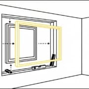 Window being fitted into frame from interior view