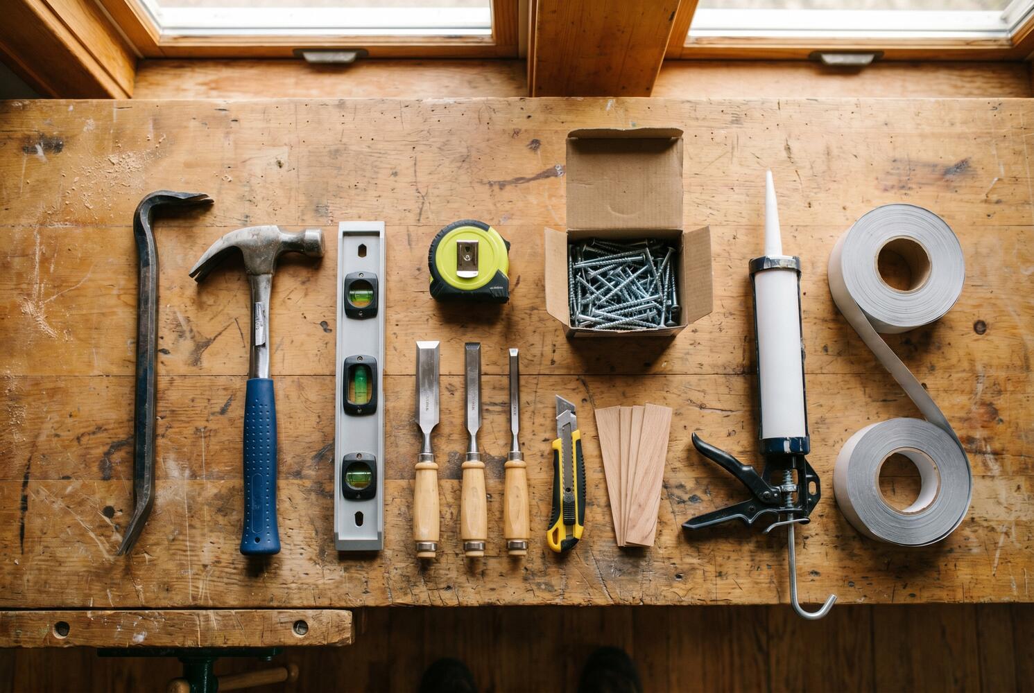Carpentry tools for exterior door frame replacement DIY project